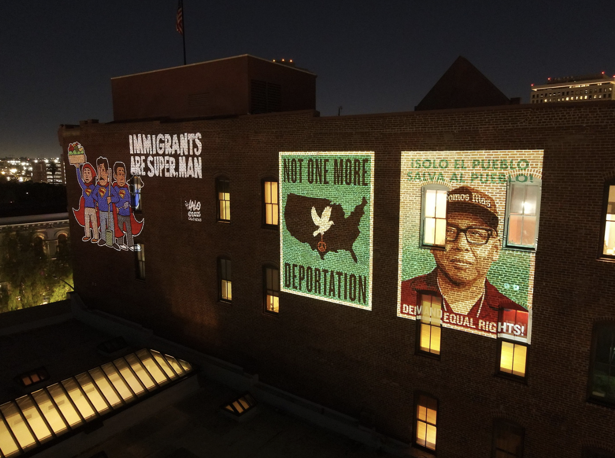 We Belong Here images projected in LA Plaza's wall