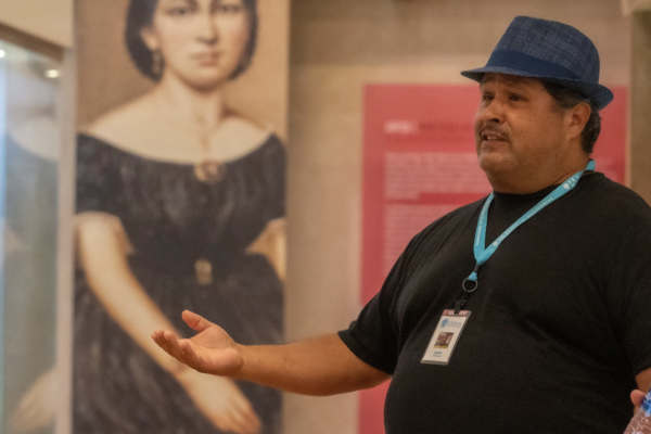 Man in hat in a museum gallery