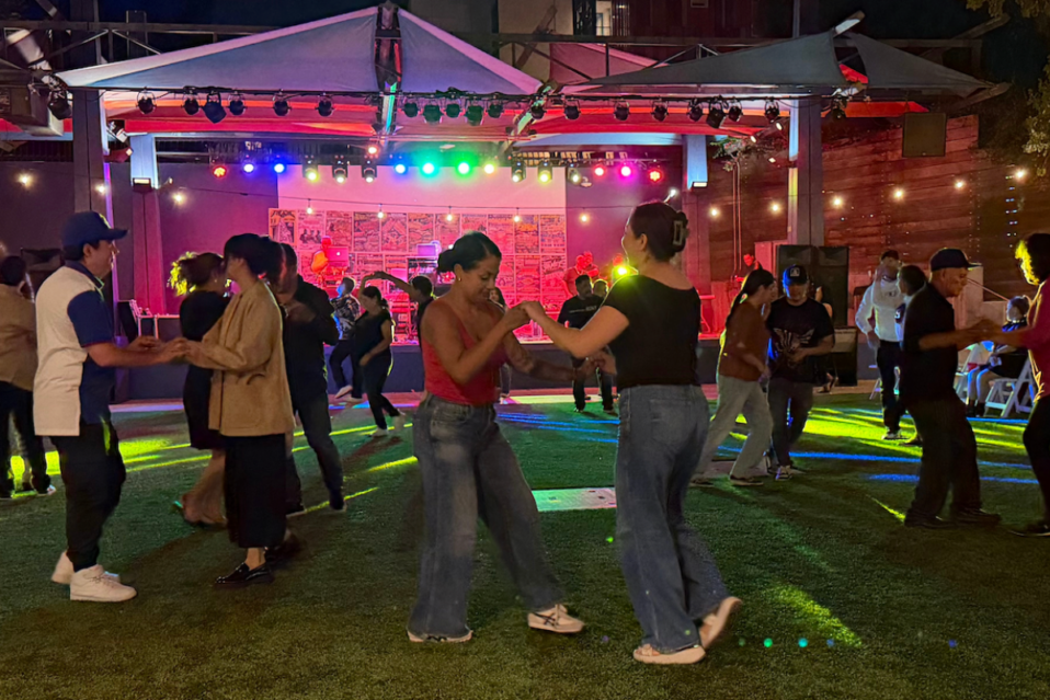 People dancing in LA Plaza's patio during a Sonidero.